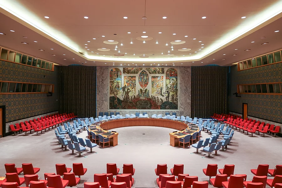 United Nations Security Council Chamber at UN Headquarters, a large conference room with a circular seating arrangement and a mural covering the back wall